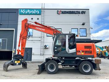 Pelle sur pneus Hitachi ZX140W-3 KOURA+UMPIKUMIRENKAAT