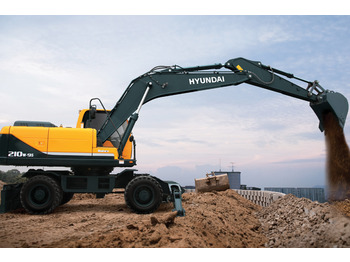 Pelle sur pneus HYUNDAI R210
