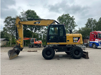 Pelle sur pneus CATERPILLAR M313D