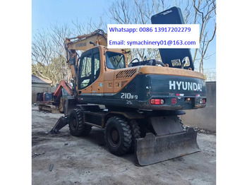 Pelle sur pneus HYUNDAI R210