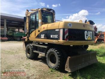 Pelle sur pneus Caterpillar m 315c: photos 4