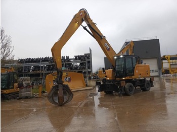 Pelle sur pneus CAT MH3024-1: photos 2