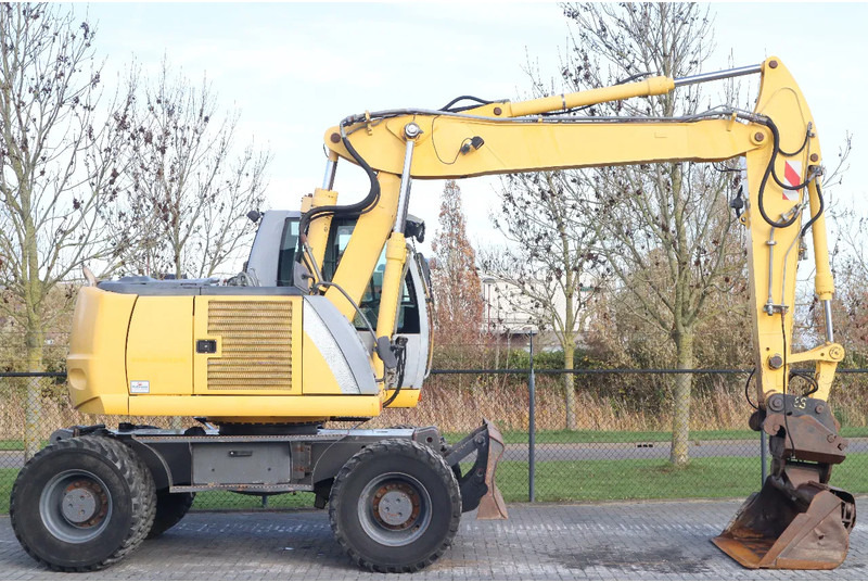 New Holland MH CITY | TILT BUCKET | QUICK COUPLER | DOZER BLADE - Pelle sur pneus: photos 4 New Holland MH CITY | TILT BUCKET | QUICK COUPLER | DOZER BLADE - Pelle sur pneus: photos 4