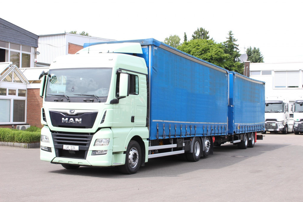 MAN TGX26.460 Durchlad Plane-Jumbo Retarder Hubdach - Camion à rideaux coulissants: photos 1 MAN TGX26.460 Durchlad Plane-Jumbo Retarder Hubdach - Camion à rideaux coulissants: photos 1