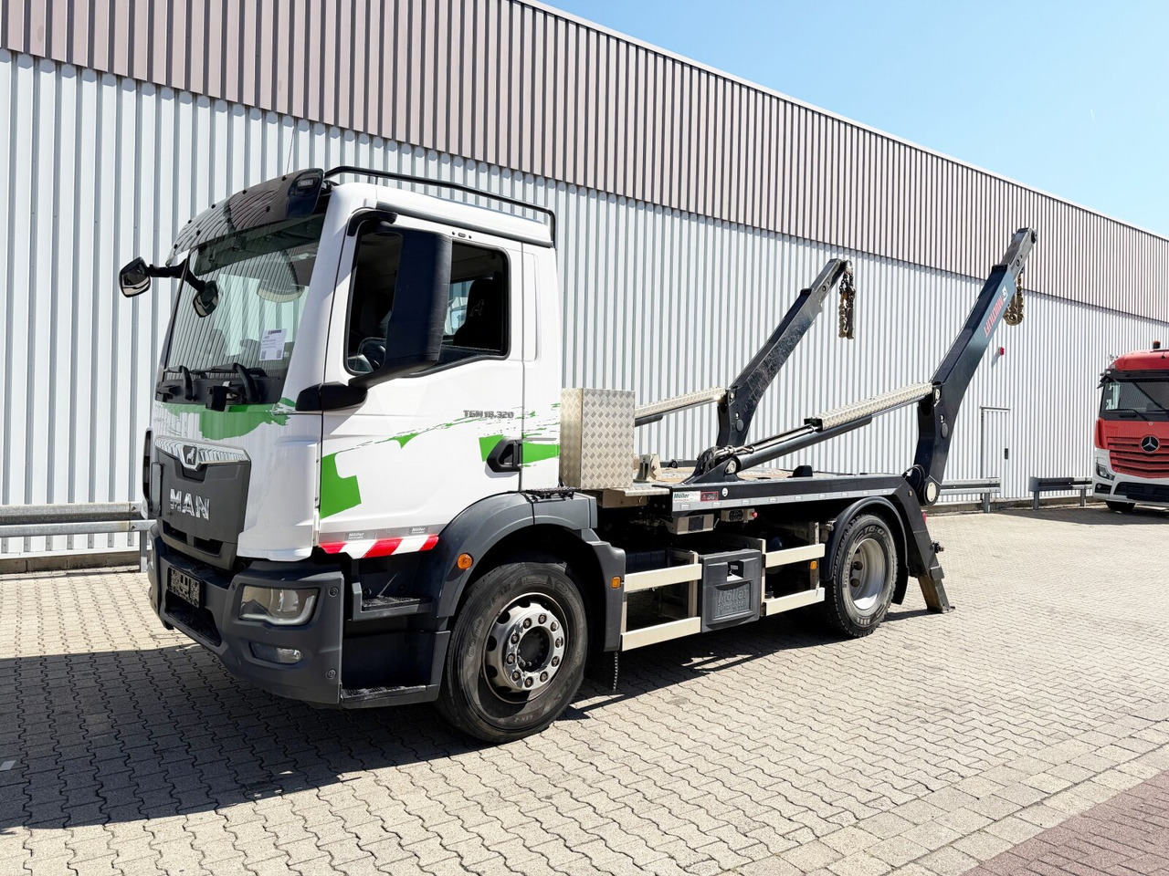 MAN TGM 18.320 4x2 BL TGM 18.320 4x2 BL, Hiab Tele-Absetzanlage, Funk - Camion multibenne: photos 1 MAN TGM 18.320 4x2 BL TGM 18.320 4x2 BL, Hiab Tele-Absetzanlage, Funk - Camion multibenne: photos 1