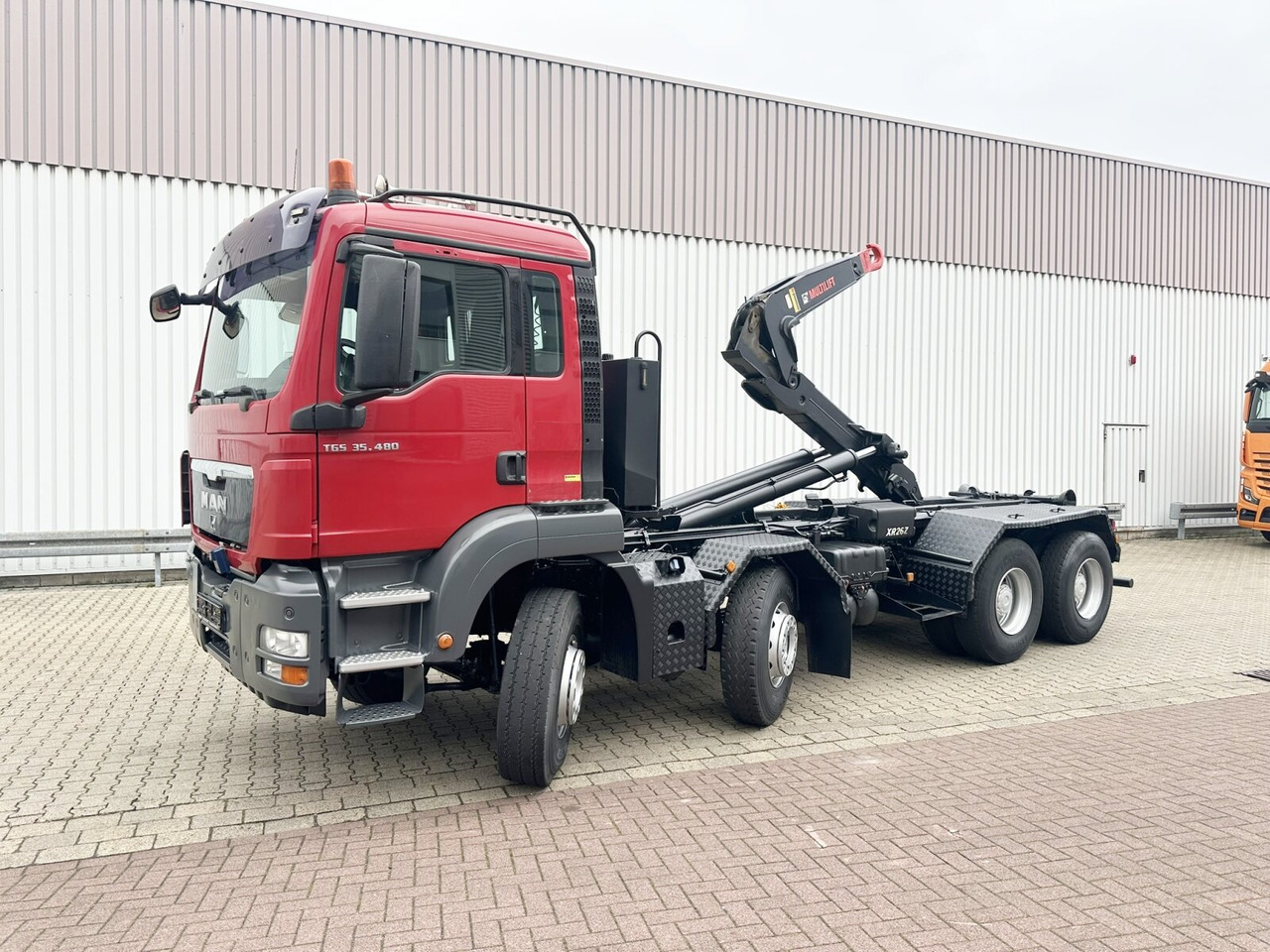 MAN TGS 35.480 8X4 BL TGS 35.400 8x4 BL, Schub-Knick bis 6,5m Container - Camion ampliroll: photos 1 MAN TGS 35.480 8X4 BL TGS 35.400 8x4 BL, Schub-Knick bis 6,5m Container - Camion ampliroll: photos 1