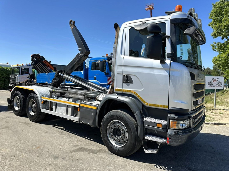 Scania G450 6x4 HOOKLIFT AJK 20T - 5760mm - 3m90 WB - HUB REDUCTION / STEEL SUSP. - EURO 6 - BE TRUCK - Camion ampliroll: photos 1 Scania G450 6x4 HOOKLIFT AJK 20T - 5760mm - 3m90 WB - HUB REDUCTION / STEEL SUSP. - EURO 6 - BE TRUCK - Camion ampliroll: photos 1
