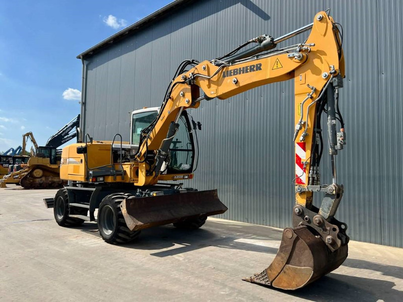 Liebherr A 311 Litronic - Pelle sur pneus: photos 3 Liebherr A 311 Litronic - Pelle sur pneus: photos 3