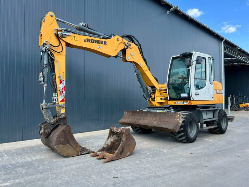 Liebherr A 311 Litronic - Pelle sur pneus: photos 1 Liebherr A 311 Litronic - Pelle sur pneus: photos 1