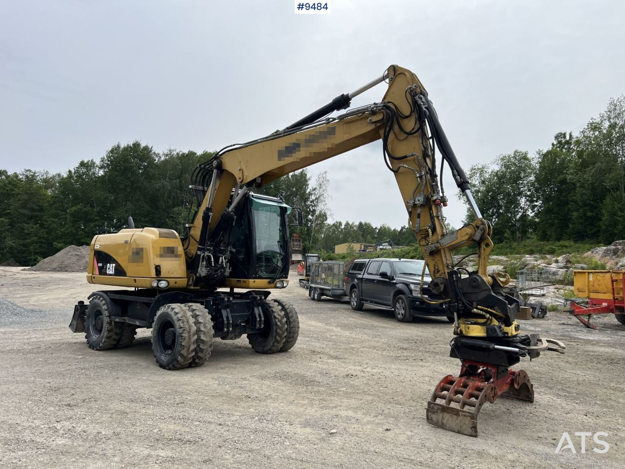 CAT M313D with tipping wagon and attachments (VIDEO) - Pelle sur pneus: photos 1 CAT M313D with tipping wagon and attachments (VIDEO) - Pelle sur pneus: photos 1
