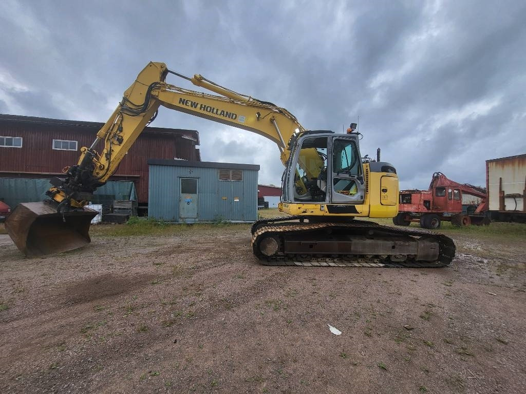 New Holland Kobelco E 235 B SR-2 - Pelle sur chenille: photos 2 New Holland Kobelco E 235 B SR-2 - Pelle sur chenille: photos 2