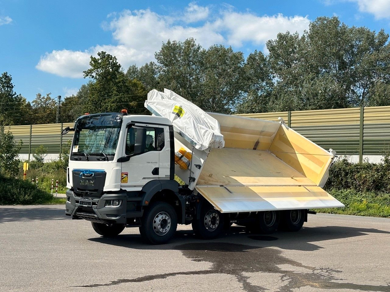MAN TGS 41.440 8x4 EuromixMTP 3-Seiten-Kipper - Camion benne: photos 1 MAN TGS 41.440 8x4 EuromixMTP 3-Seiten-Kipper - Camion benne: photos 1