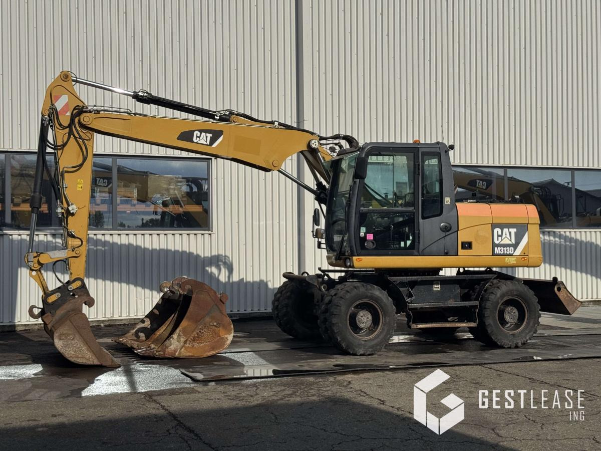Caterpillar M313D - Pelle sur pneus: photos 1 Caterpillar M313D - Pelle sur pneus: photos 1