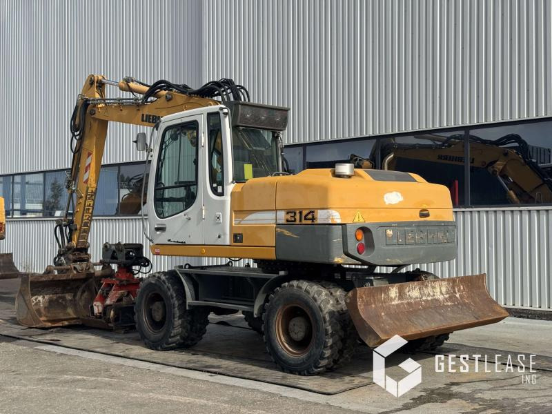 Liebherr A314 Litronic - Pelle sur pneus: photos 3 Liebherr A314 Litronic - Pelle sur pneus: photos 3