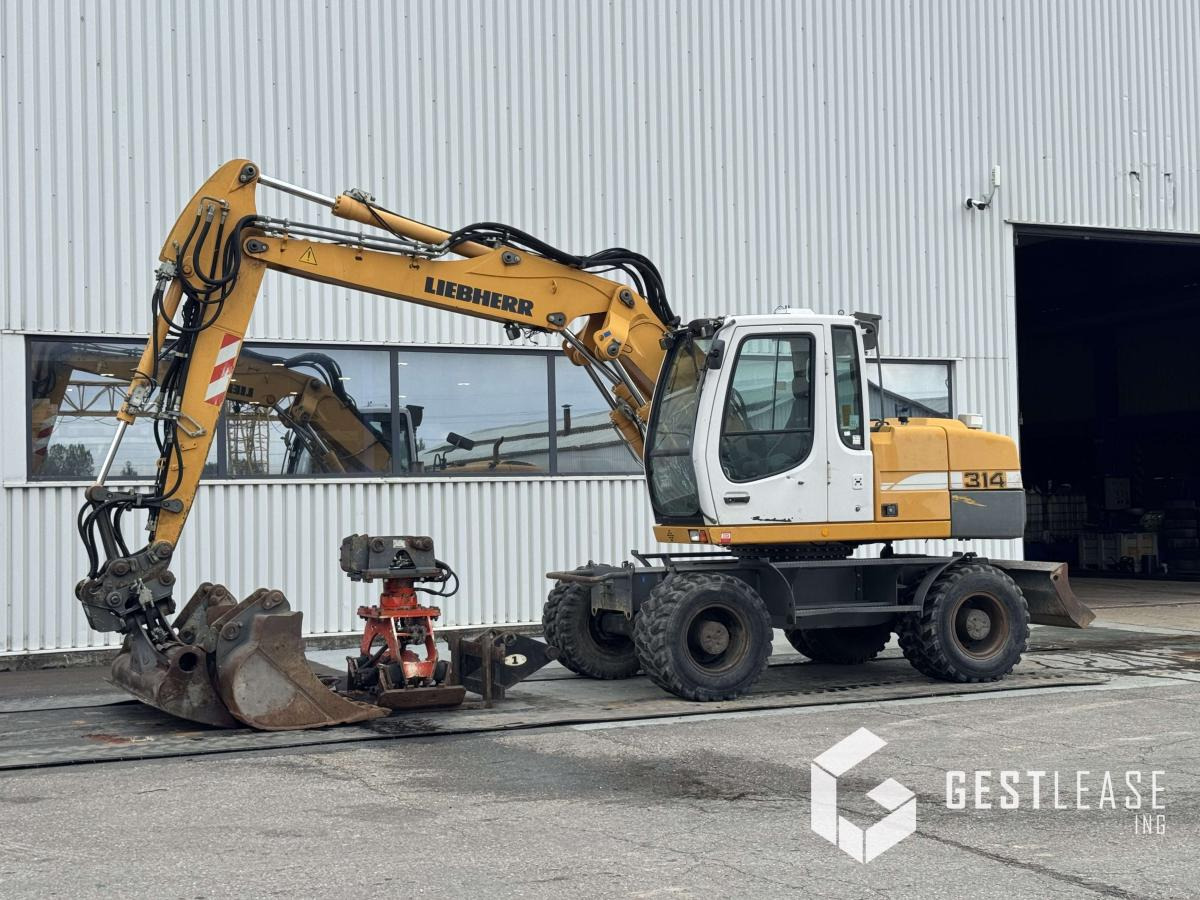 Liebherr A314 Litronic - Pelle sur pneus: photos 1 Liebherr A314 Litronic - Pelle sur pneus: photos 1