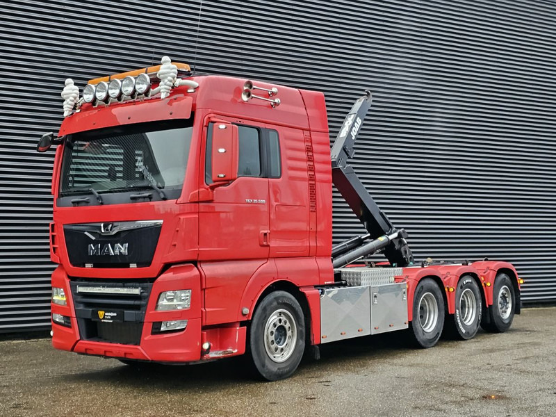 MAN TGX 35.500 / 8x4-4 / ABROLL-KIPPER / HOOKLIFT - Camion ampliroll: photos 1 MAN TGX 35.500 / 8x4-4 / ABROLL-KIPPER / HOOKLIFT - Camion ampliroll: photos 1