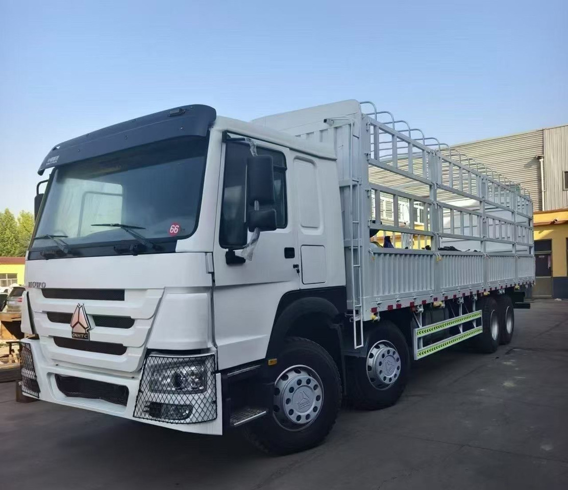 SINOTRUK HOWO 8*4 WITH FENCE DUMP TRUCK LIVESTOCK TRUCK - Camion benne: photos 1 SINOTRUK HOWO 8*4 WITH FENCE DUMP TRUCK LIVESTOCK TRUCK - Camion benne: photos 1