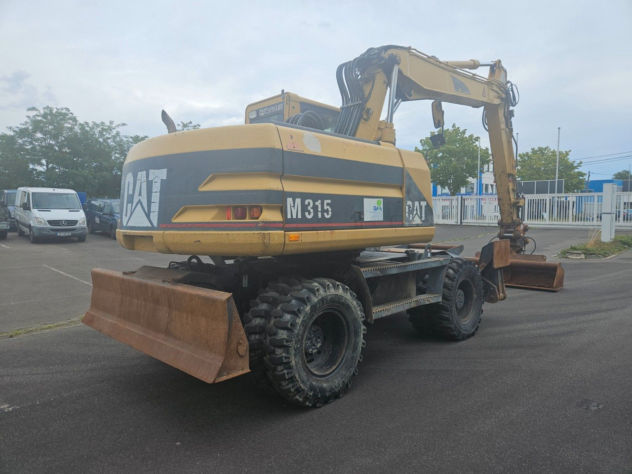 CAT M315 Mobilbagger mit Pratzen und Schild - Pelle sur pneus: photos 3 CAT M315 Mobilbagger mit Pratzen und Schild - Pelle sur pneus: photos 3