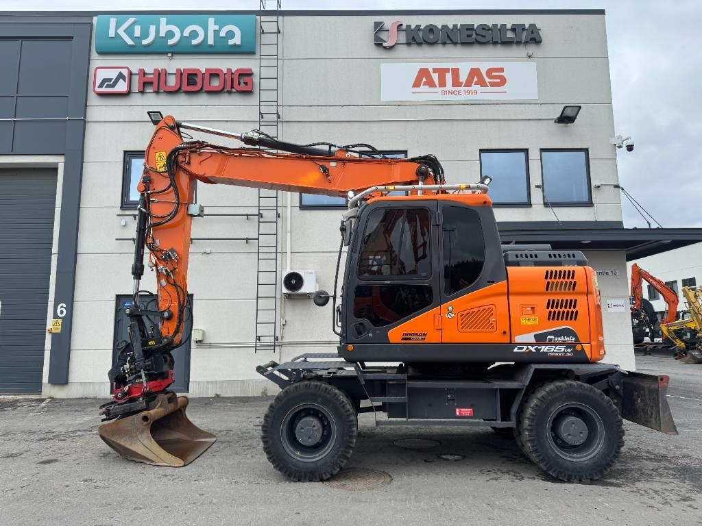 Doosan DX 165 W-5 - Pelle sur pneus: photos 1 Doosan DX 165 W-5 - Pelle sur pneus: photos 1
