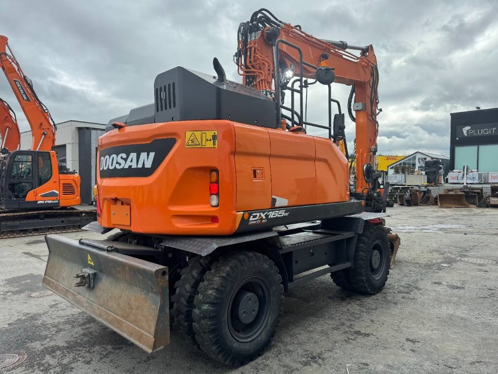 Doosan DX 165 W-5 - Pelle sur pneus: photos 5 Doosan DX 165 W-5 - Pelle sur pneus: photos 5