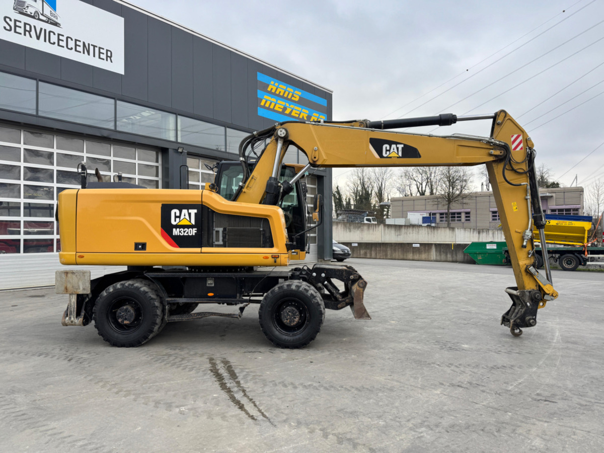 CATERPILLAR M320F Oilquick - Pelle sur pneus: photos 3 CATERPILLAR M320F Oilquick - Pelle sur pneus: photos 3