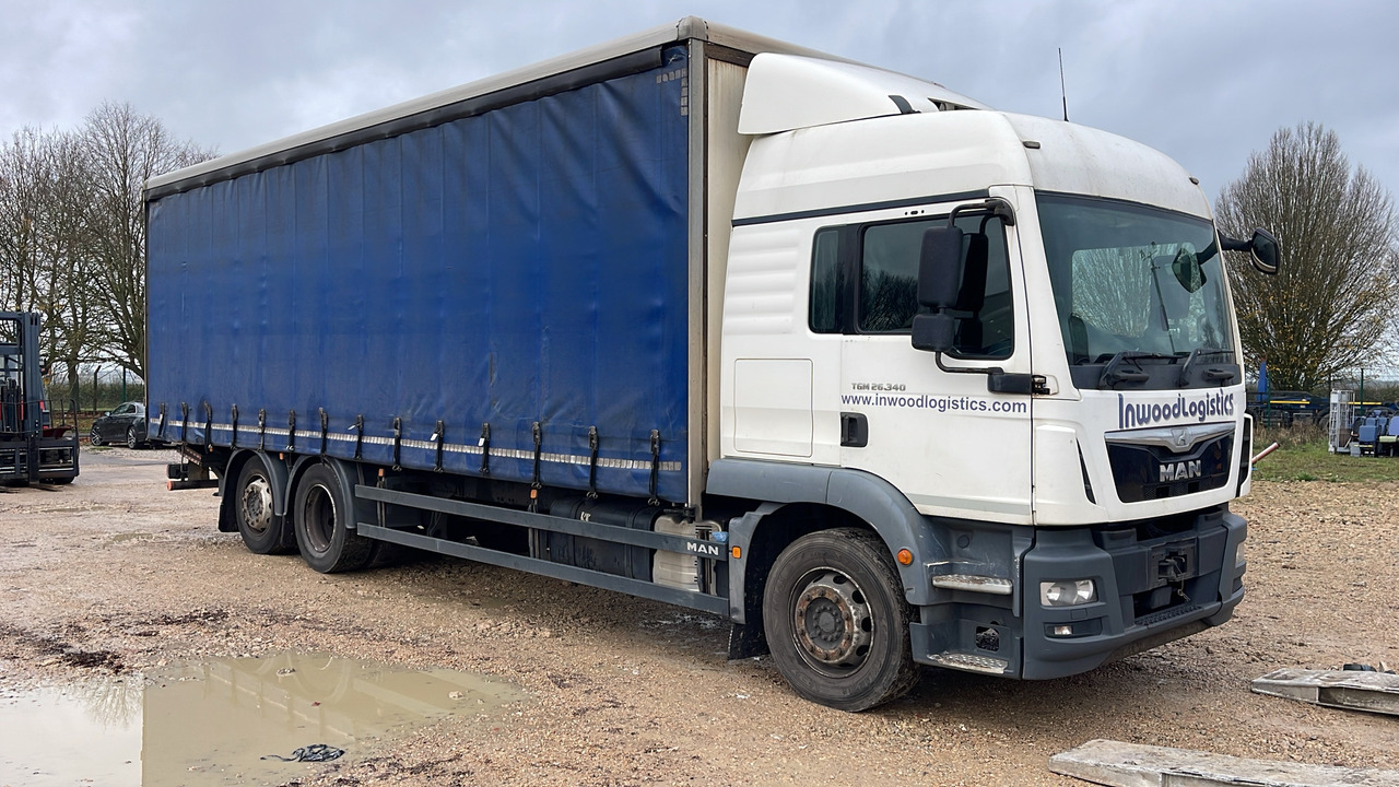 MAN TGM 26.340 - Camion à rideaux coulissants: photos 1 MAN TGM 26.340 - Camion à rideaux coulissants: photos 1
