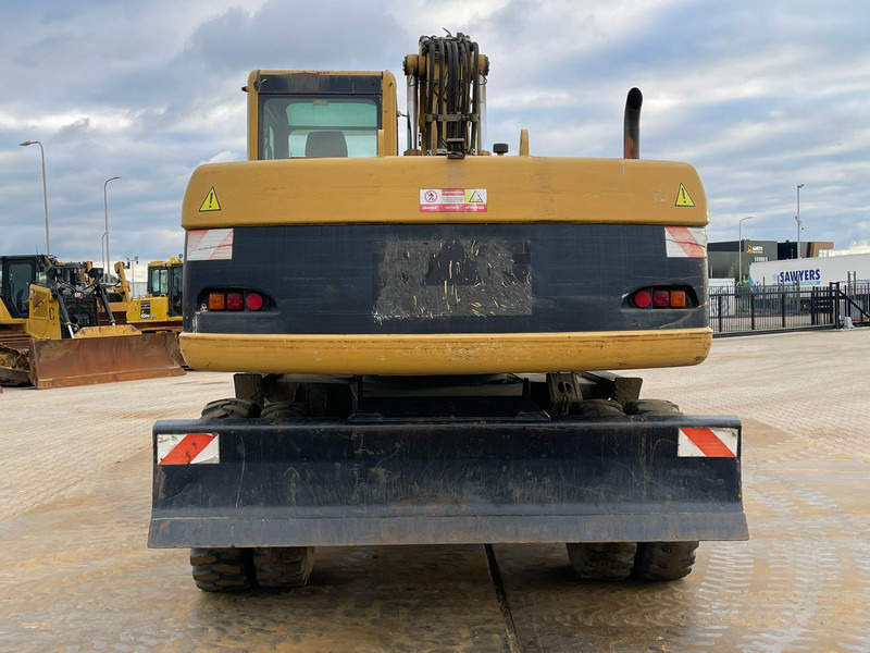 Caterpillar M318C - Pelle sur pneus: photos 4 Caterpillar M318C - Pelle sur pneus: photos 4
