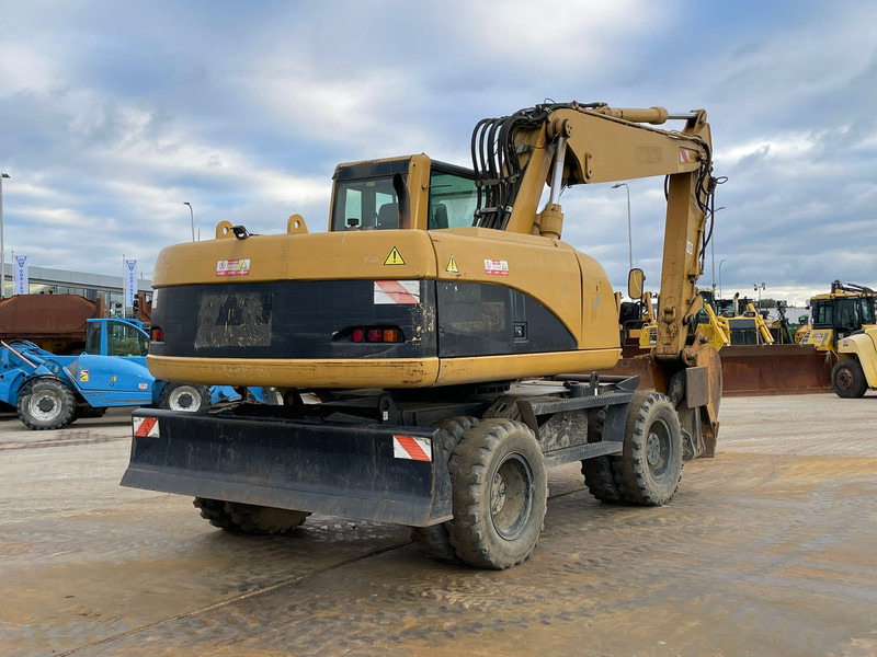 Caterpillar M318C - Pelle sur pneus: photos 5 Caterpillar M318C - Pelle sur pneus: photos 5