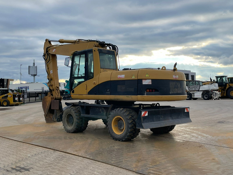 Caterpillar M318C - Pelle sur pneus: photos 3 Caterpillar M318C - Pelle sur pneus: photos 3