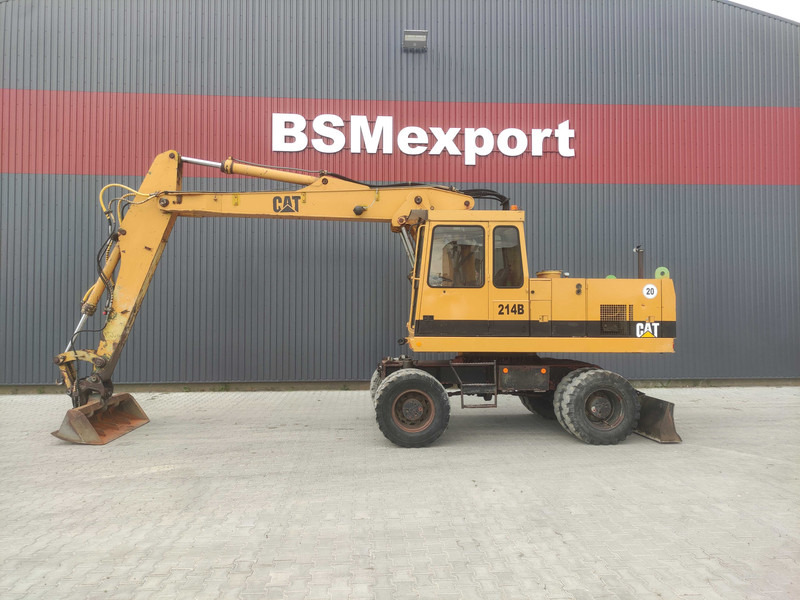 Caterpillar 214 B wheel excavator - Pelle sur pneus: photos 1 Caterpillar 214 B wheel excavator - Pelle sur pneus: photos 1