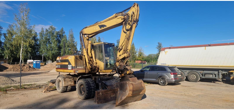 Caterpillar M 315 Rototilt - Pelle sur pneus: photos 1 Caterpillar M 315 Rototilt - Pelle sur pneus: photos 1