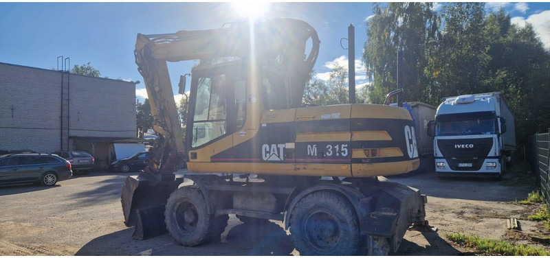 Caterpillar M 315 Rototilt - Pelle sur pneus: photos 3 Caterpillar M 315 Rototilt - Pelle sur pneus: photos 3