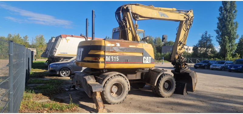 Caterpillar M 315 Rototilt - Pelle sur pneus: photos 2 Caterpillar M 315 Rototilt - Pelle sur pneus: photos 2