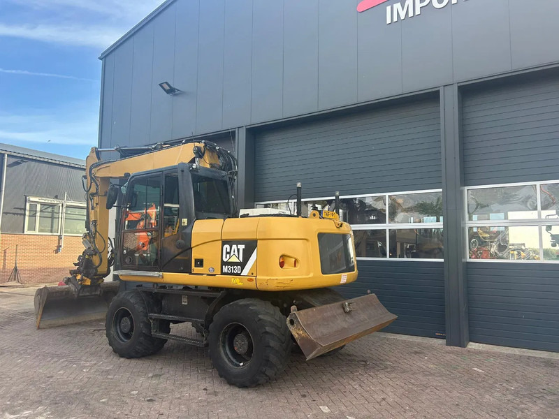 Caterpillar M313D - Pelle sur pneus: photos 2 Caterpillar M313D - Pelle sur pneus: photos 2