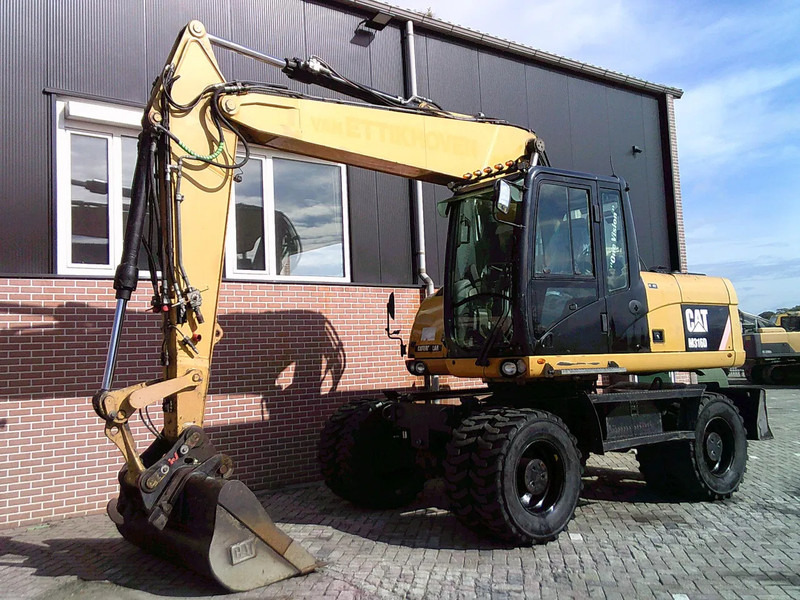 Caterpillar M316D - Pelle sur pneus: photos 1 Caterpillar M316D - Pelle sur pneus: photos 1