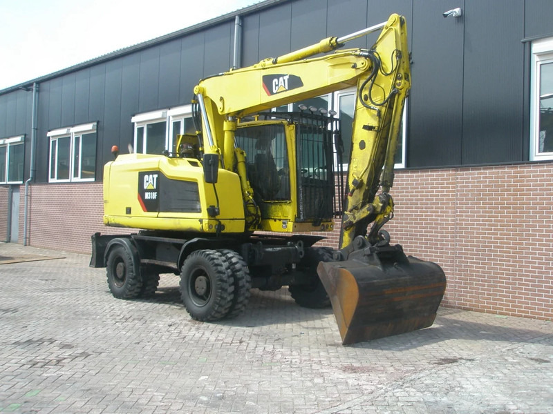 Caterpillar M318F - Pelle sur pneus: photos 4 Caterpillar M318F - Pelle sur pneus: photos 4