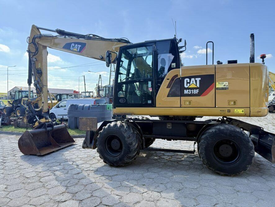 CAT M318F - Pelle sur pneus: photos 1 CAT M318F - Pelle sur pneus: photos 1
