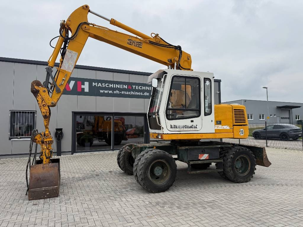 Liebherr A 312 - Pelle sur pneus: photos 1 Liebherr A 312 - Pelle sur pneus: photos 1