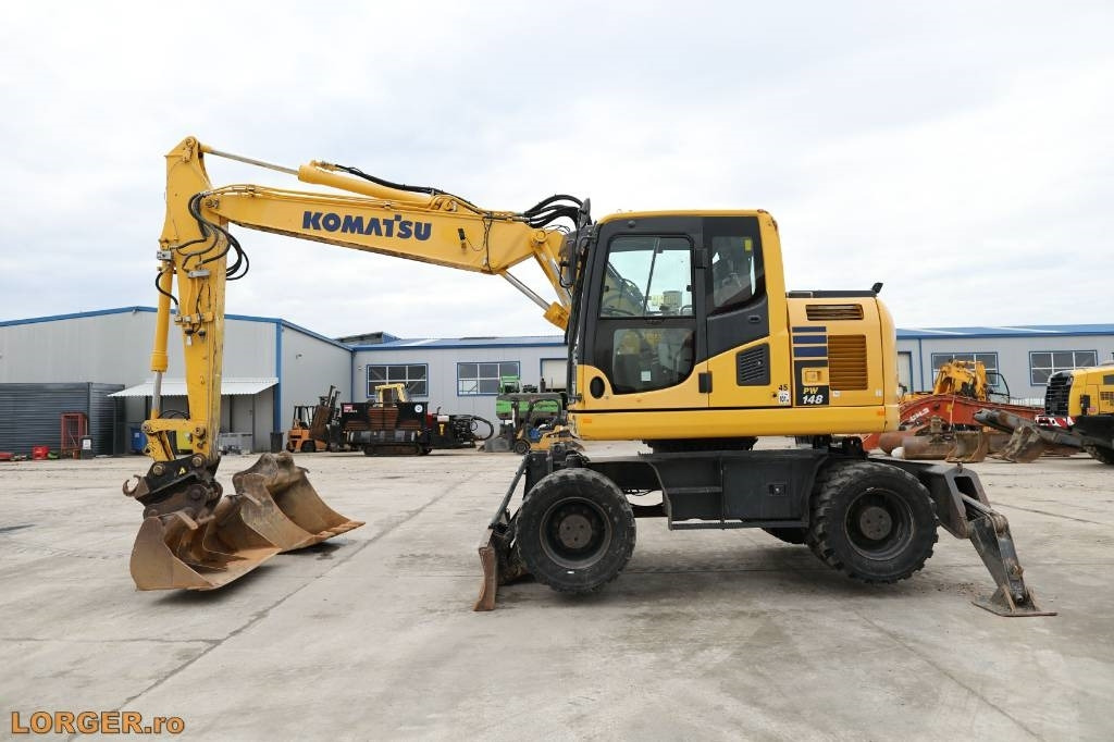 Komatsu PW 148-10 - Pelle sur pneus: photos 1 Komatsu PW 148-10 - Pelle sur pneus: photos 1