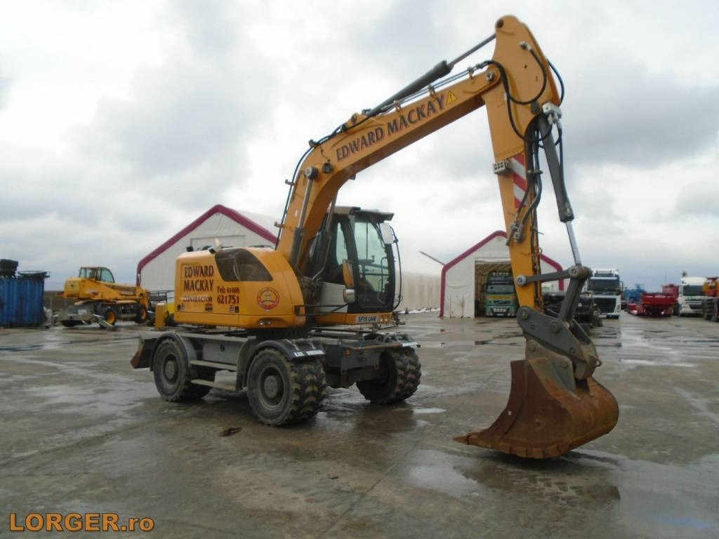 Pelle sur pneus Liebherr A 914: photos 6