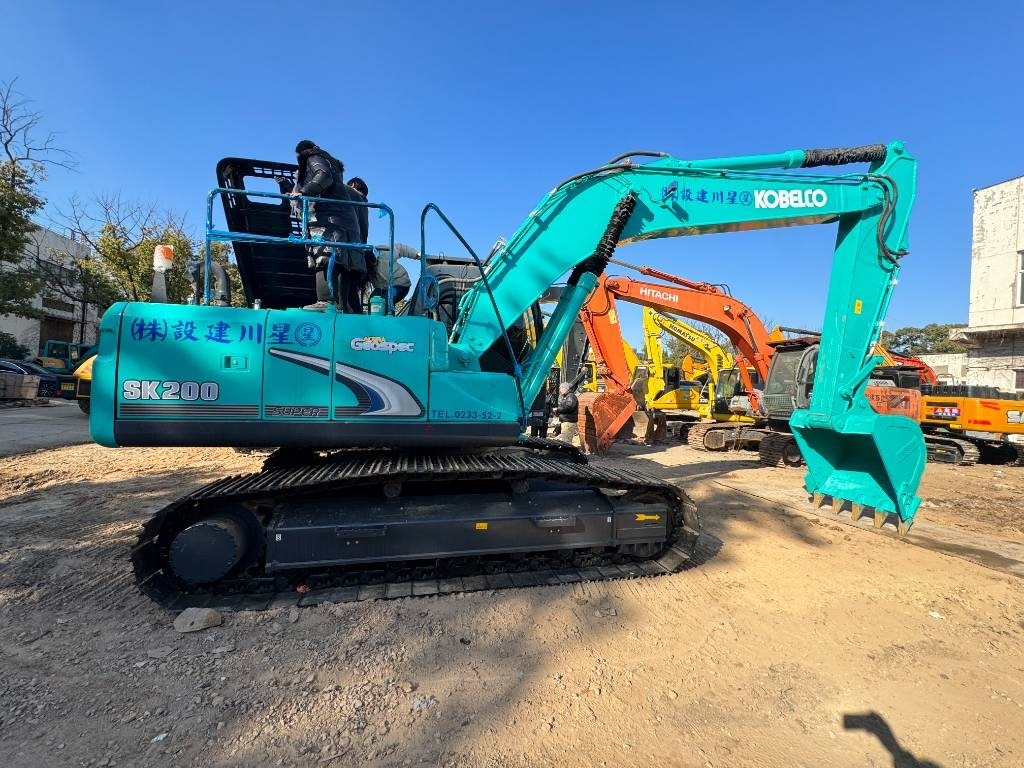 Kobelco SK 200 - Pelle sur chenille: photos 1 Kobelco SK 200 - Pelle sur chenille: photos 1