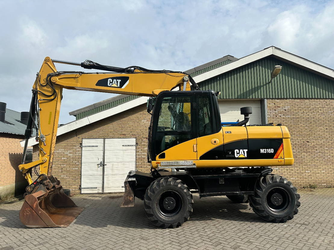 Caterpillar M316D - Pelle sur pneus: photos 1 Caterpillar M316D - Pelle sur pneus: photos 1