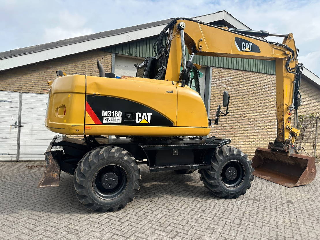 Caterpillar M316D - Pelle sur pneus: photos 5 Caterpillar M316D - Pelle sur pneus: photos 5