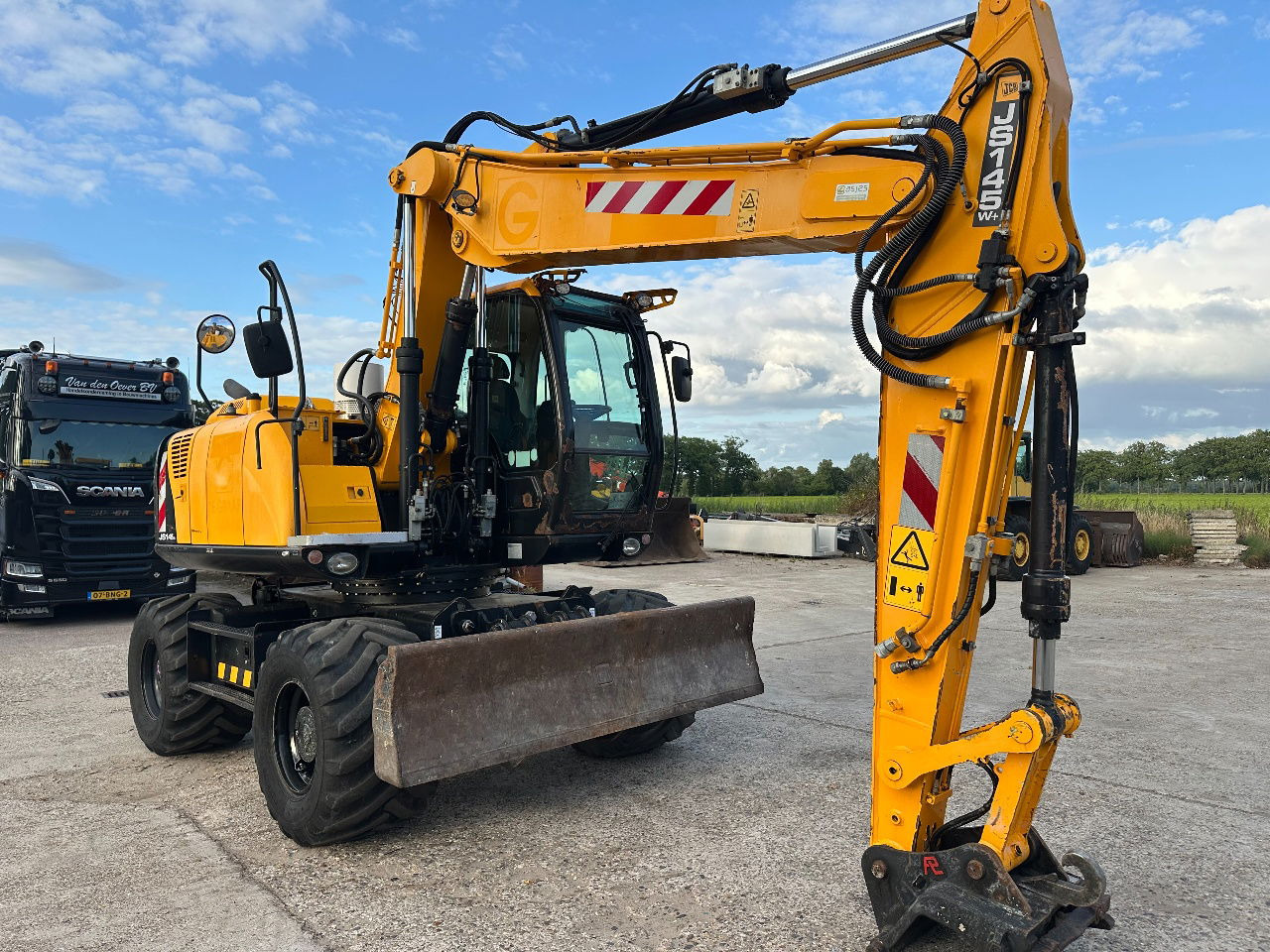 Pelle sur pneus JCB JS145W: photos 6