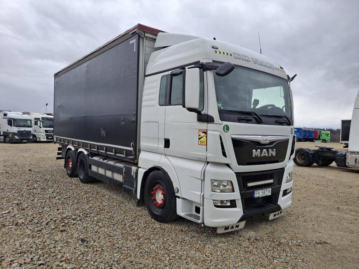 MAN TGX SOLÓWKA - Camion à rideaux coulissants: photos 1 MAN TGX SOLÓWKA - Camion à rideaux coulissants: photos 1