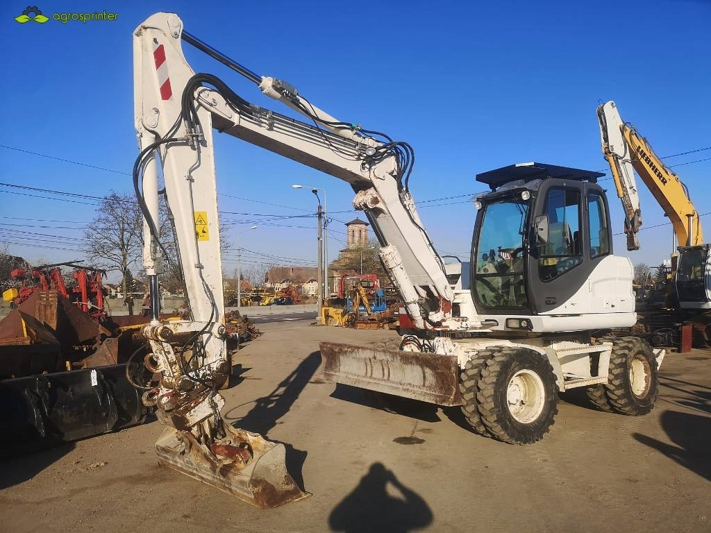 Case WX 125 - Pelle sur pneus: photos 1 Case WX 125 - Pelle sur pneus: photos 1