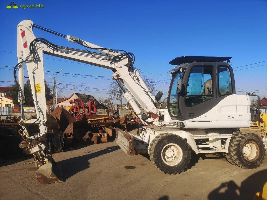 Case WX 125 - Pelle sur pneus: photos 3 Case WX 125 - Pelle sur pneus: photos 3