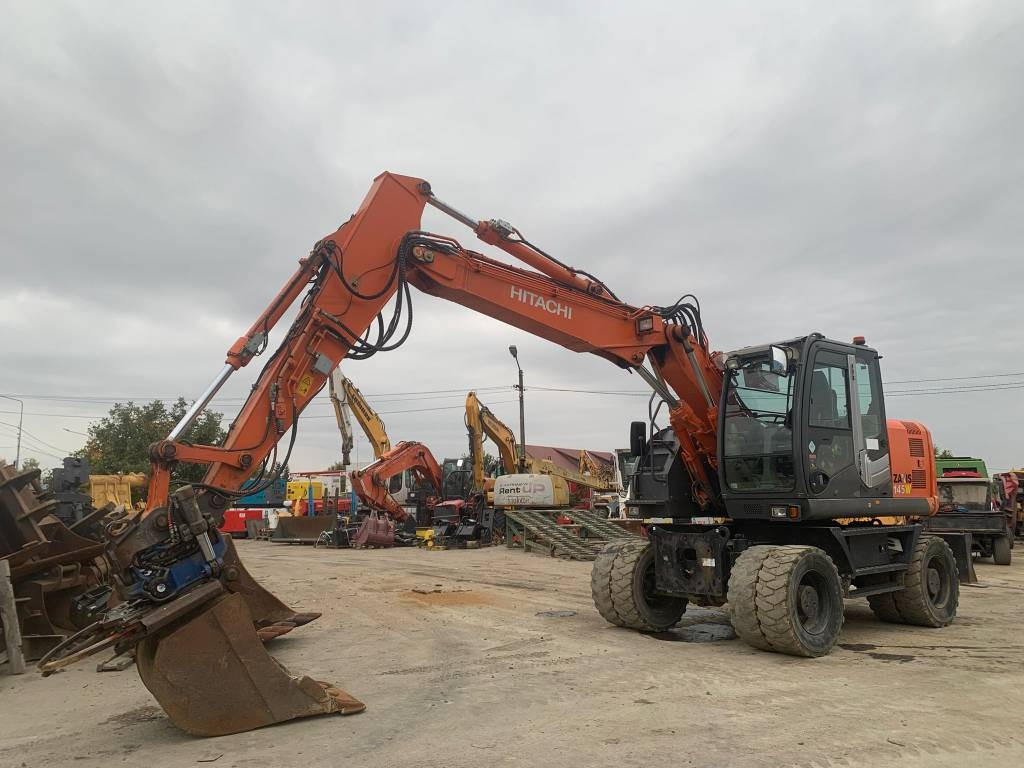 Hitachi ZX 145 W-3+SMP Rototilt  - Pelle sur pneus: photos 1 Hitachi ZX 145 W-3+SMP Rototilt  - Pelle sur pneus: photos 1