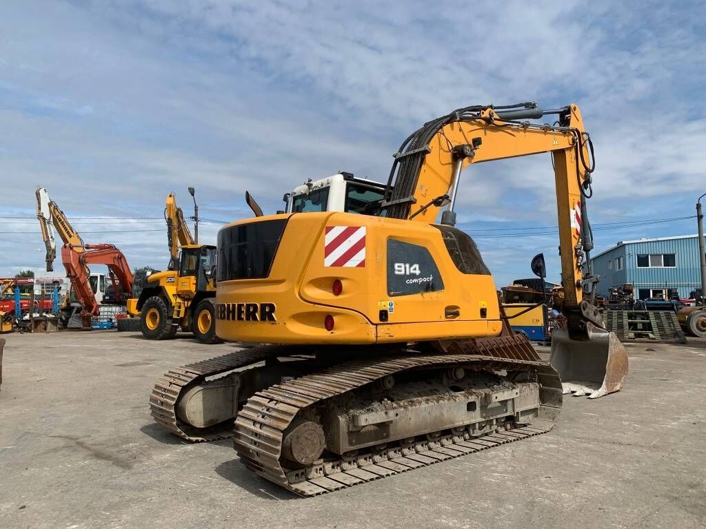 Liebherr R 914 Compact Litronic Liebherr R 914 Compact Litronic - Pelle sur pneus: photos 4 Liebherr R 914 Compact Litronic Liebherr R 914 Compact Litronic - Pelle sur pneus: photos 4