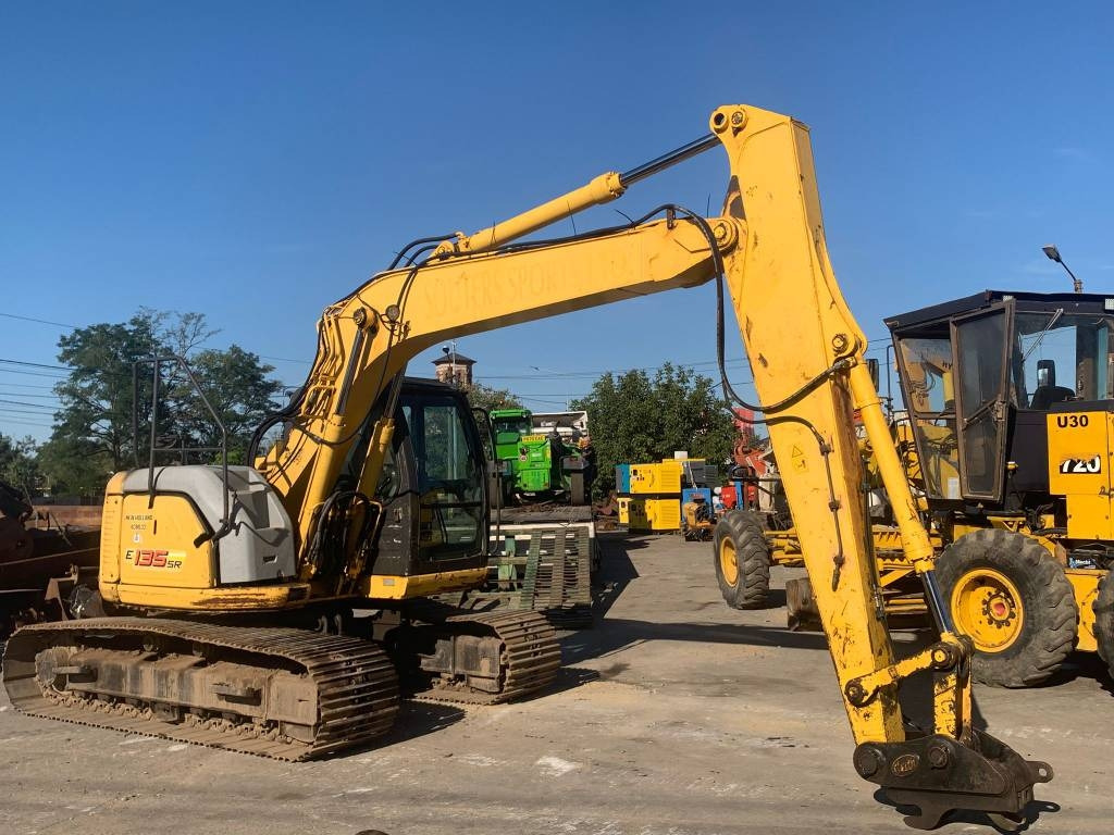 New Holland E 135 SR - Pelle sur chenille: photos 1 New Holland E 135 SR - Pelle sur chenille: photos 1